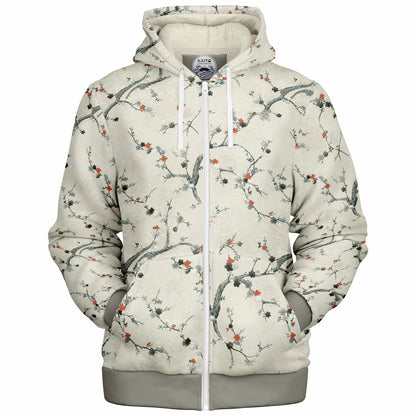 A zip-up hoodie with a white and gray base, featuring an all-over cherry blossom branch pattern with small red and orange flowers. The hoodie has a white zipper, white drawstrings, and a gray ribbed hem and cuffs, shown against a plain white background.