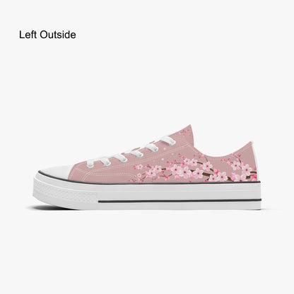 Pink floral sneakers on a white background