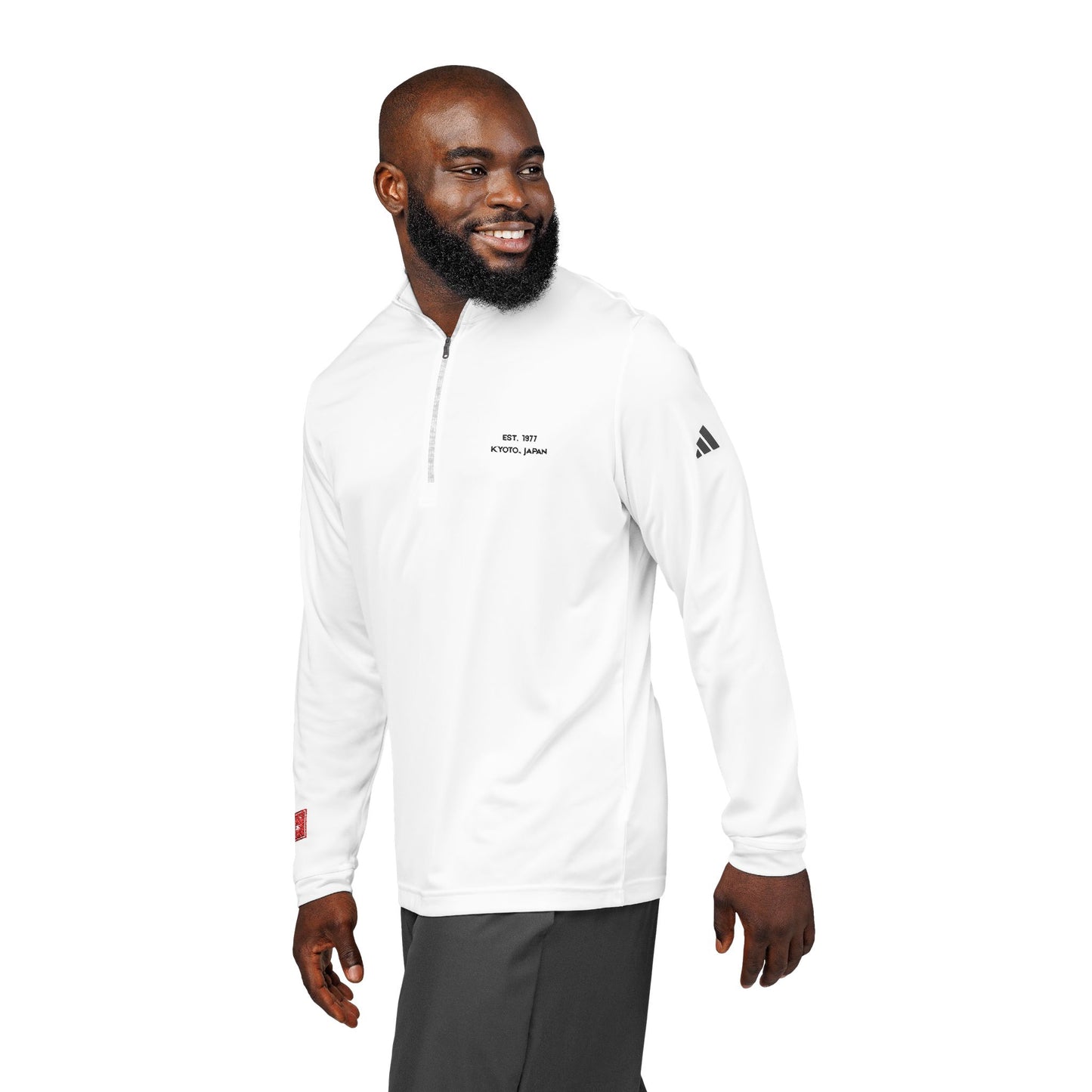 Man wearing a white Adidas jacket on a white background