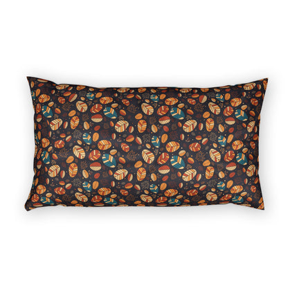 A rectangular lumbar pillow with a dark background and an all-over autumn leaf pattern in orange, brown, teal, and cream, shown against a plain white background.