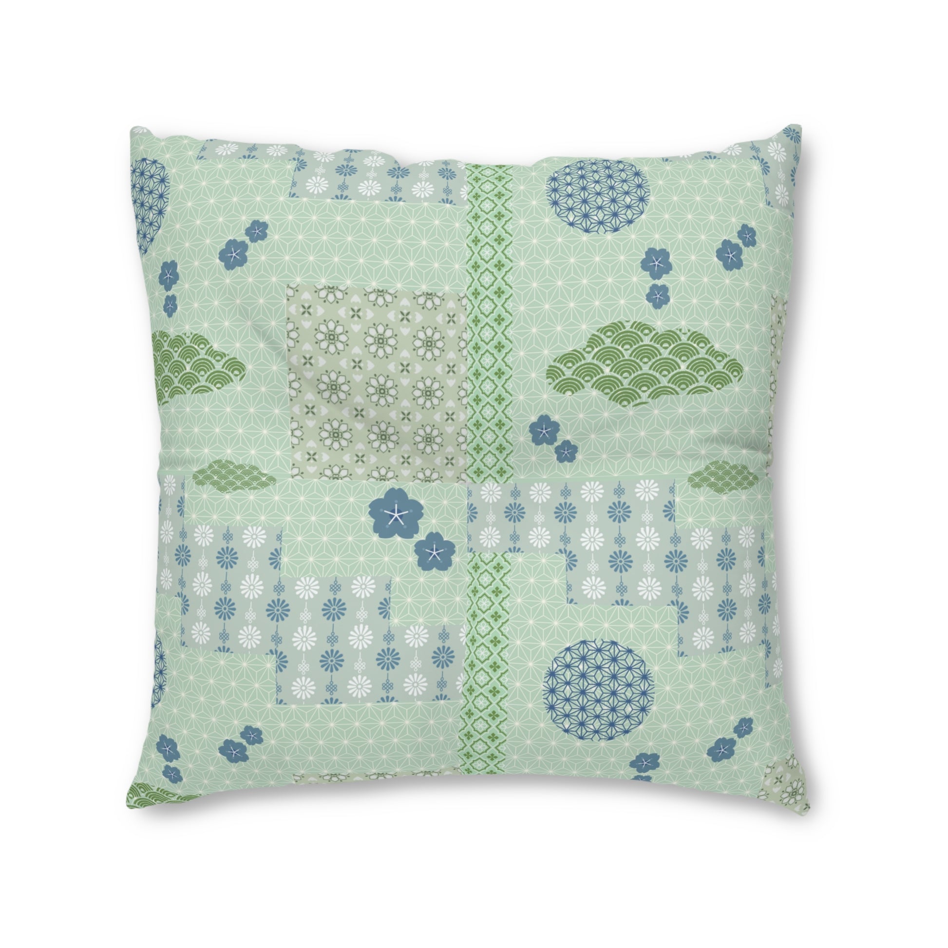 A square decorative throw pillow featuring a light mint green patchwork design with various Japanese-inspired patterns, including floral motifs, wave designs, and geometric borders in shades of green, blue, and white.