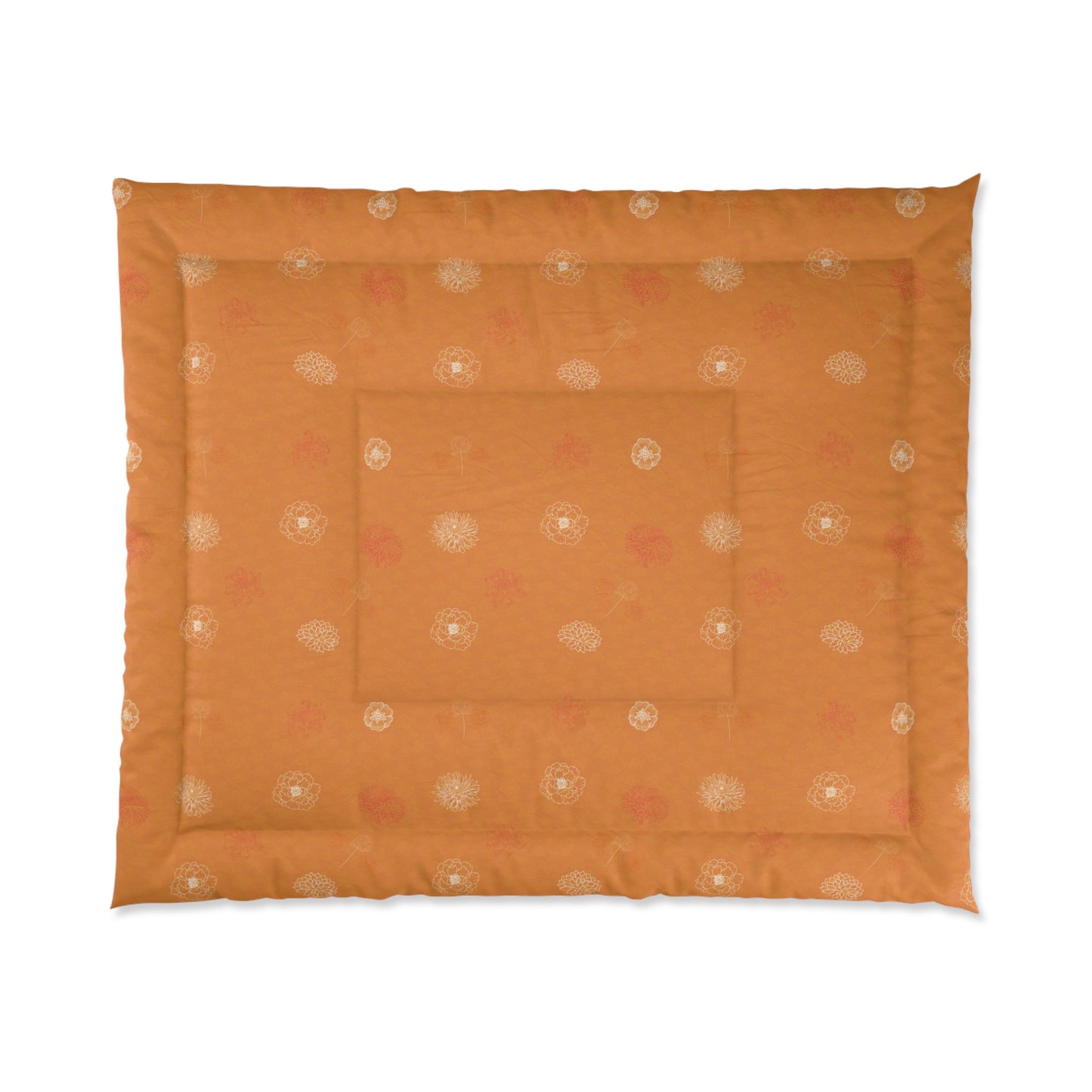 An orange quilted pet bed with a subtle pattern of small white and pink floral motifs, shown flat against a white background.