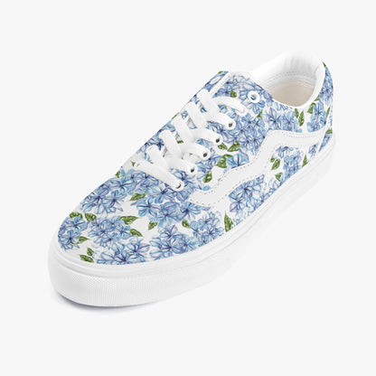 Sneaker with blue floral pattern on a white background