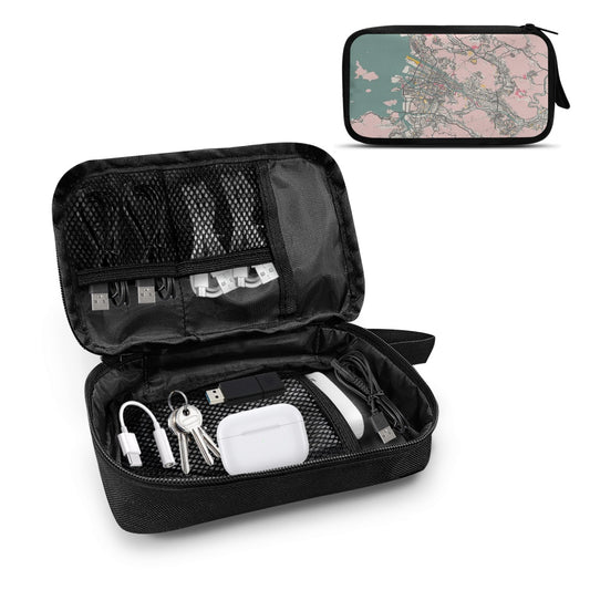 Black travel organization bag with various items on a white background