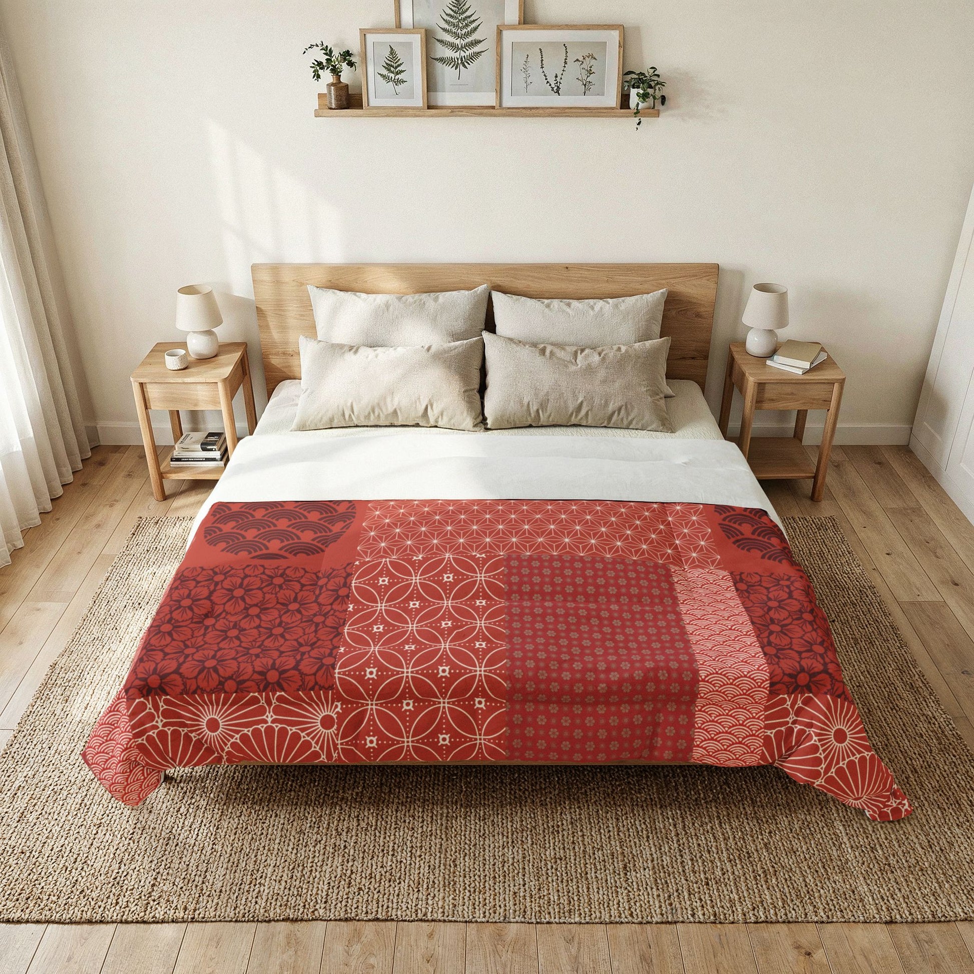 Bedroom with a bed featuring a red and white patterned duvet cover, wooden headboard, and side tables. Cotton Heritage