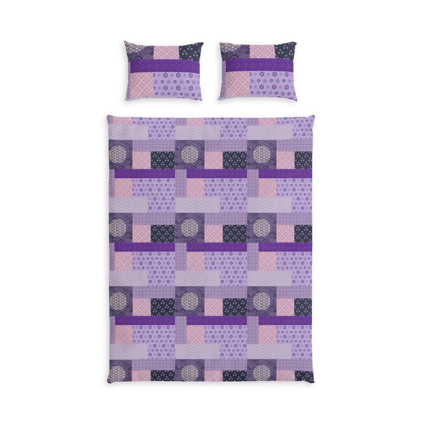 A bedding set featuring a quilt and two matching pillowcases with a geometric patchwork design in shades of purple, pink, and dark gray on a white background.
