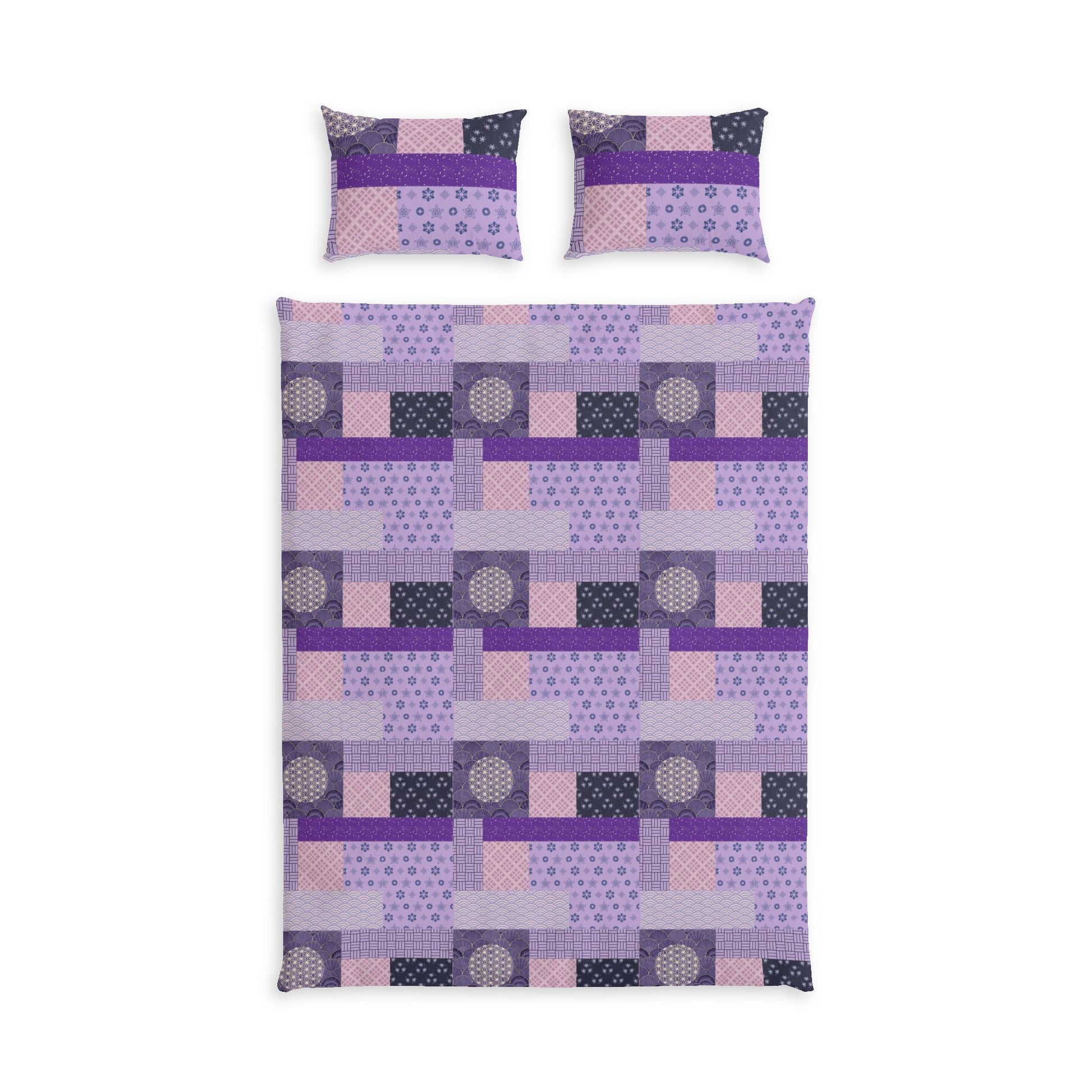 A bedding set featuring a quilt and two matching pillowcases with a geometric patchwork design in shades of purple, pink, and dark gray on a white background.