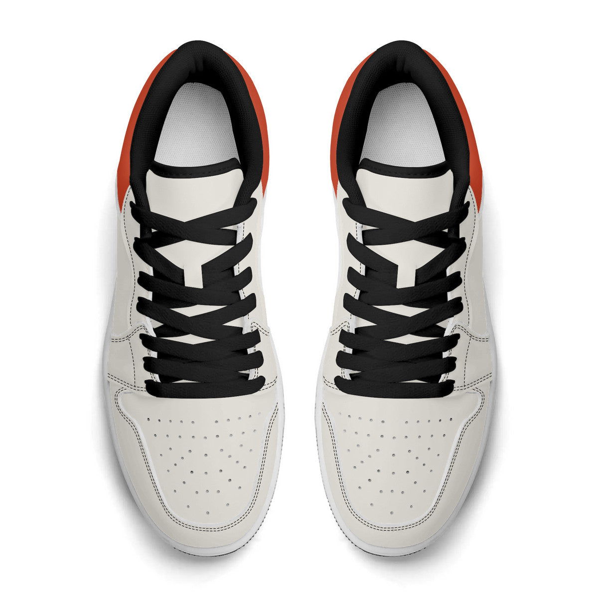White sneakers with black laces on a white background