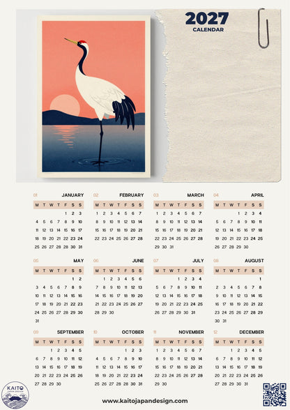 A 2027 calendar planner page with a stylized illustration of a white crane over a pink and orange sunset on the cover, plus a spiral-bound notebook and paperclip graphic at the top. The lower portion shows a full monthly calendar grid from January to December on a light beige background.