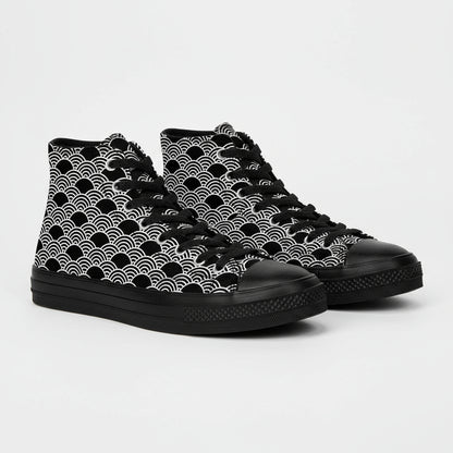 Black high-top sneakers with white wave pattern on a cardboard box