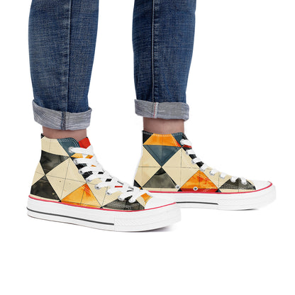 Colorful geometric-patterned sneakers worn with rolled-up jeans on a white background