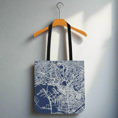 Tote bag with city map design on a hanger against a white background