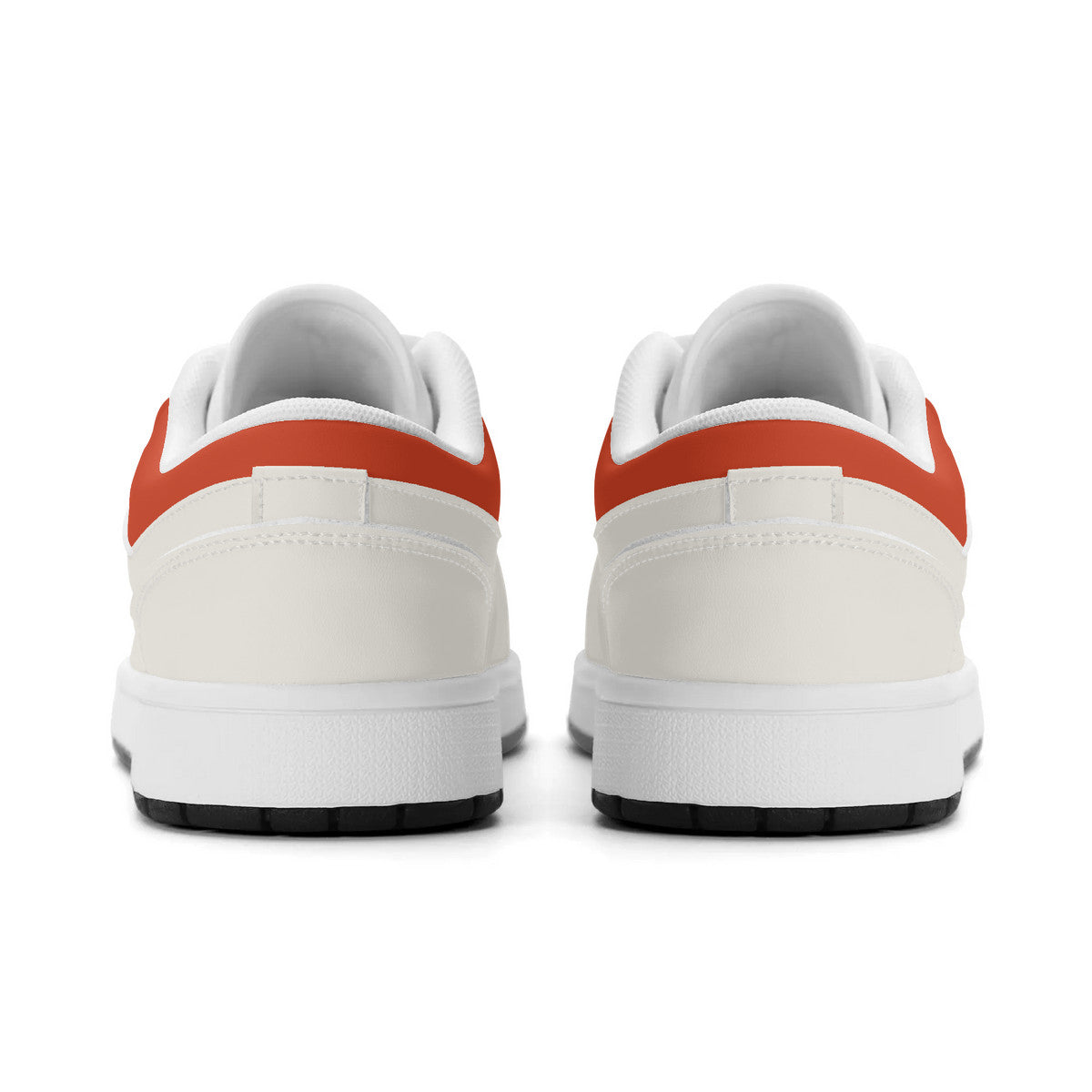 White sneakers with orange accents on a white background
