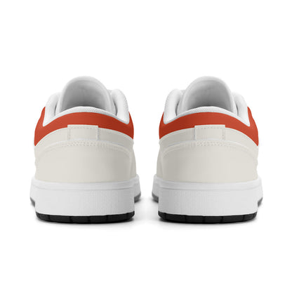 White sneakers with orange accents on a white background