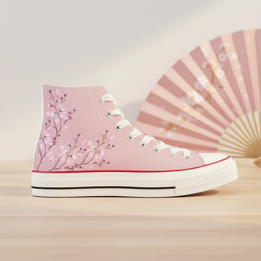 ide view of a premium soft pink high-top sneaker featuring an elegant all-over print of white and darker pink cherry blossoms on delicate brown branches