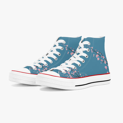 Blue high-top sneakers with white laces and a floral pattern on a white background