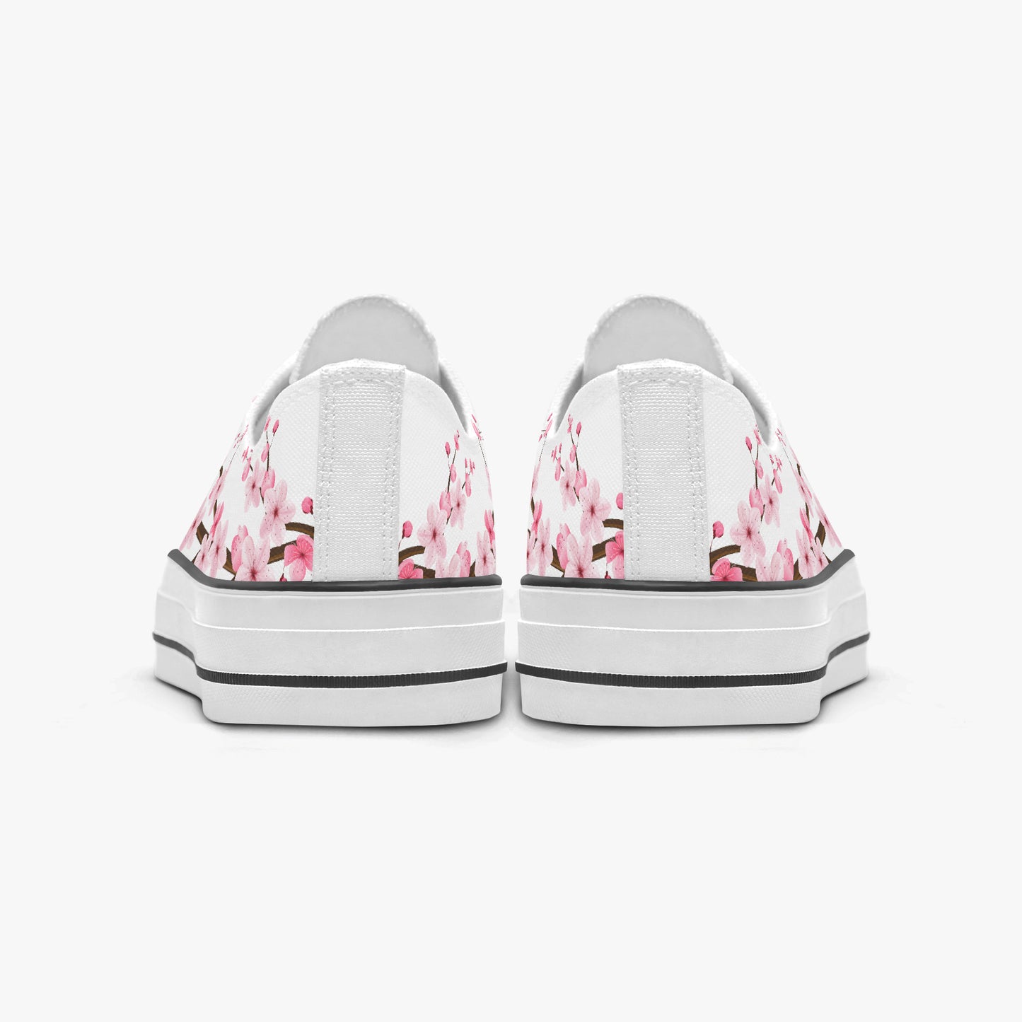 White sneakers with pink floral pattern on a white background