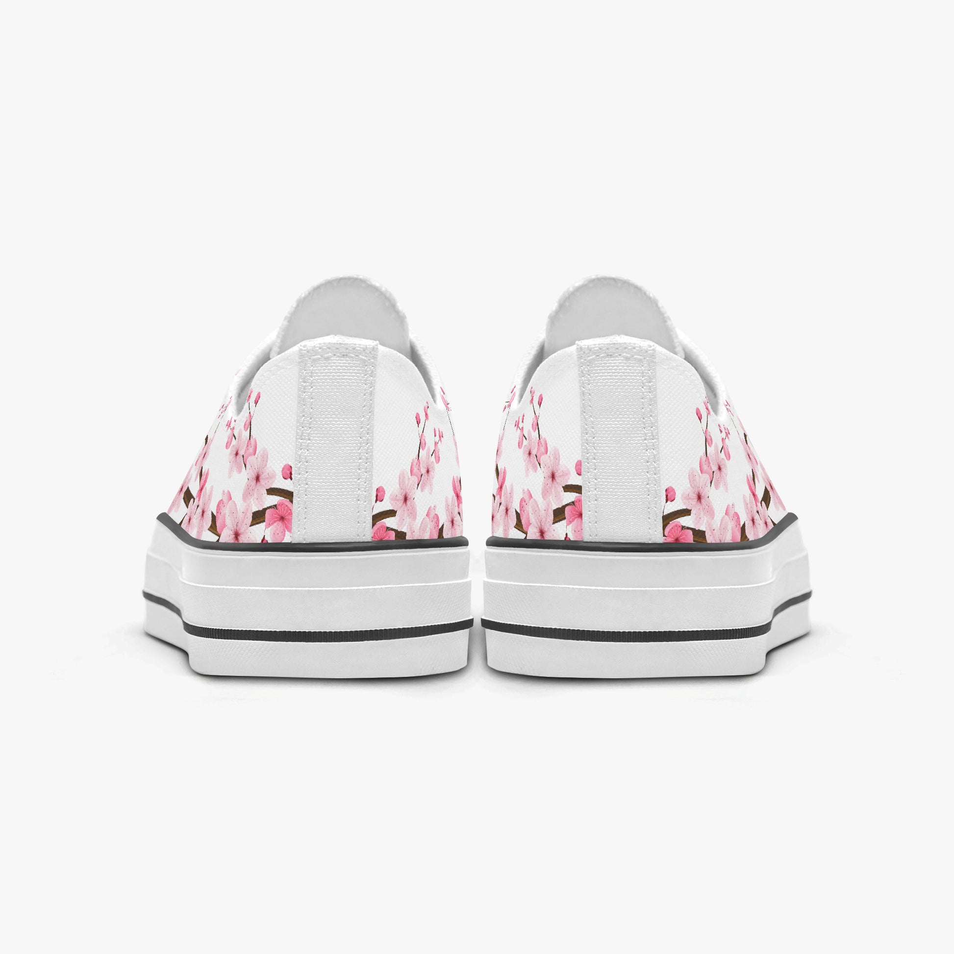 White sneakers with pink floral pattern on a white background