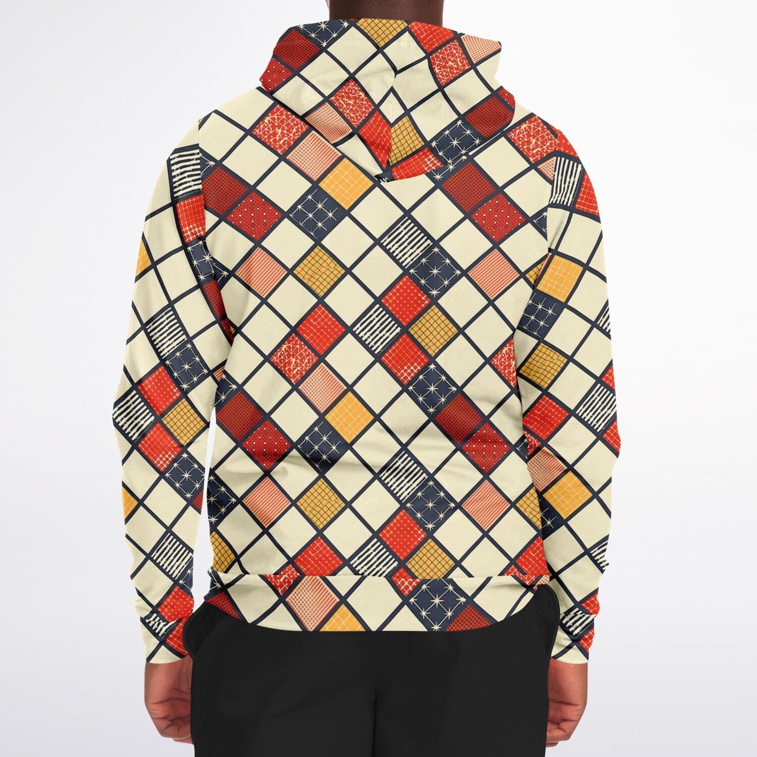 Person wearing a colorful geometric patterned shirt on a white background