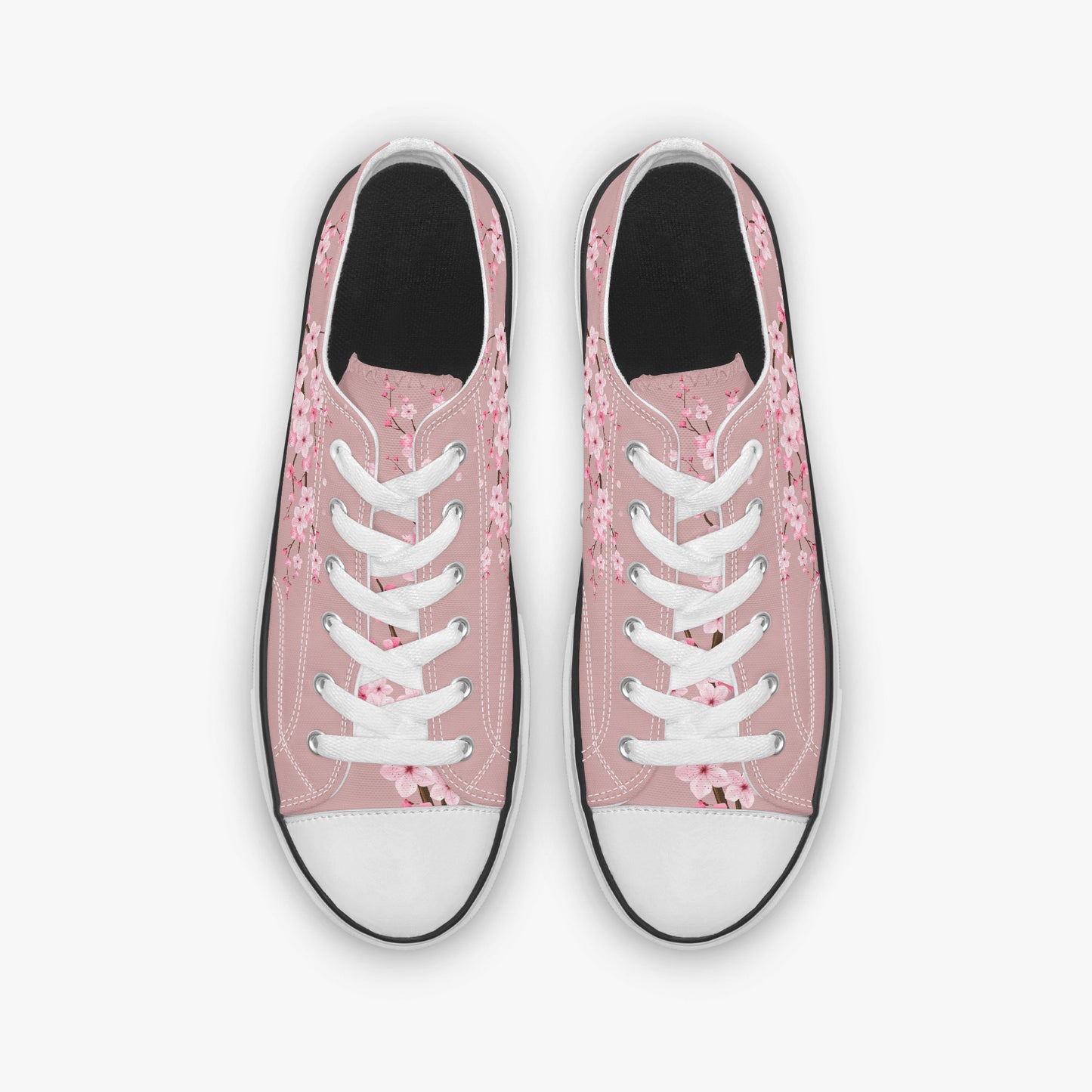 Pink floral sneakers with white laces on a white background
