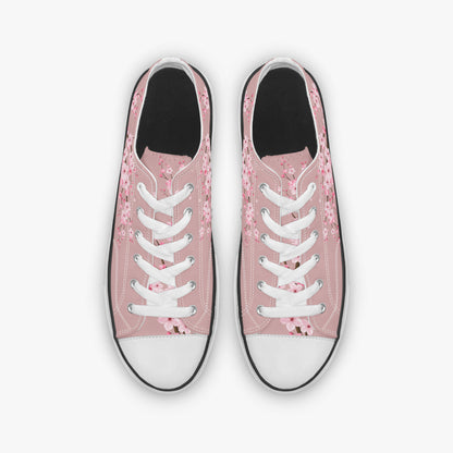 Pink floral sneakers with white laces on a white background