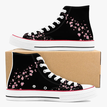 Black high-top sneakers with pink floral design on a cardboard box