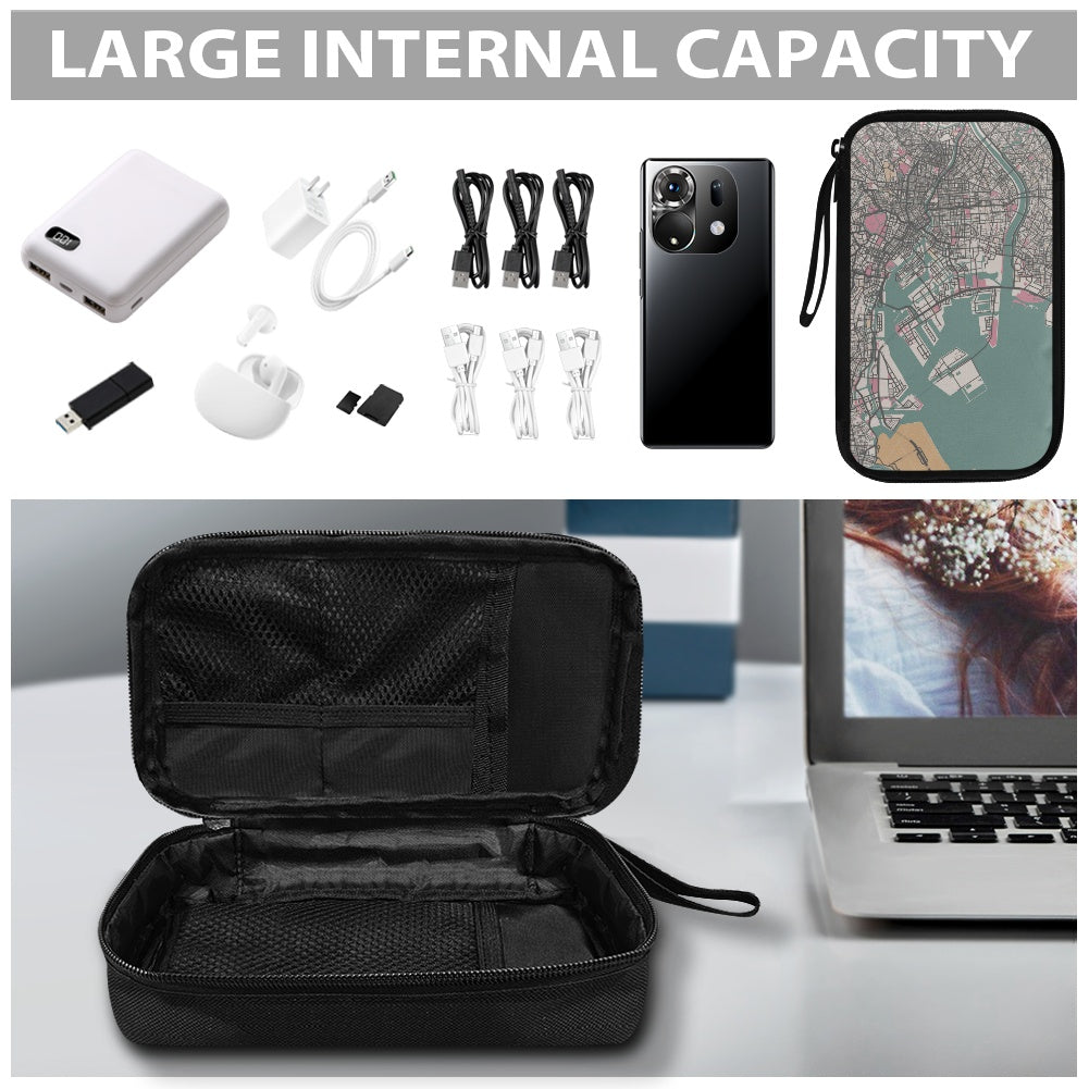 Black travel case with electronic accessories on a desk