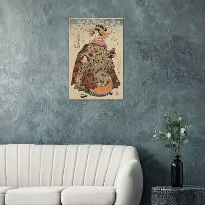 Traditional Japanese artwork on a wall above a white sofa with a vase of greenery.