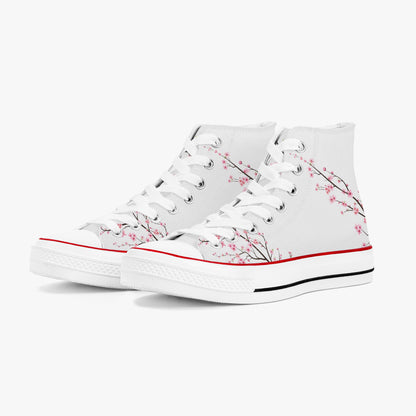 White high-top sneakers with cherry blossom design on a white background