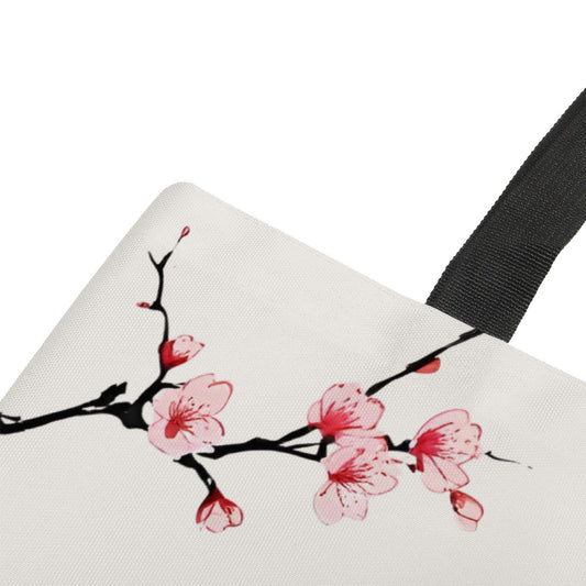 Canvas bag with cherry blossom design and black strap on a white background