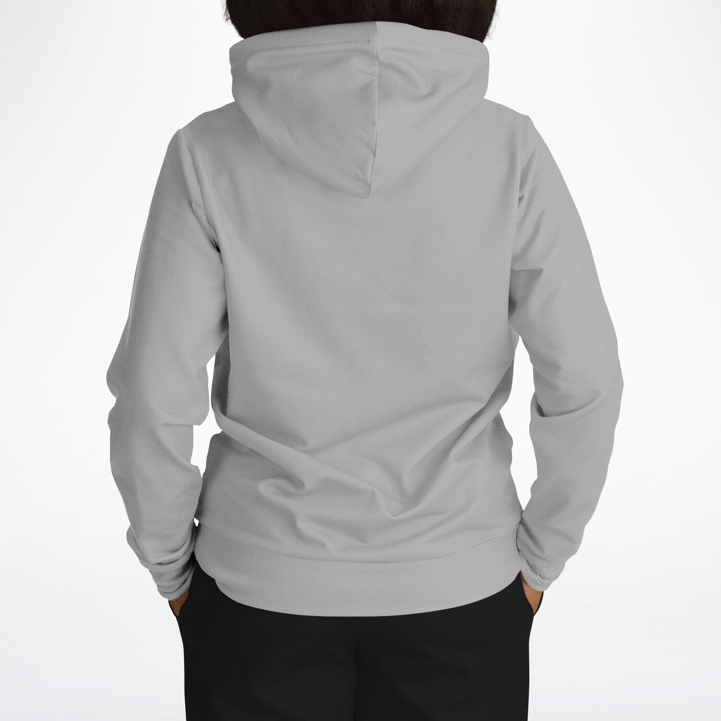 A person viewed from the back wearing a light gray hooded sweatshirt and black pants against a plain white studio background.