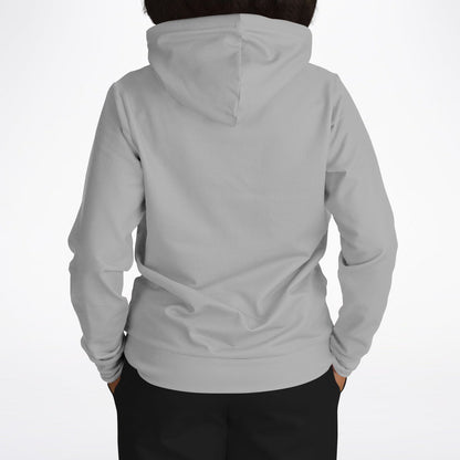 A person viewed from the back wearing a light gray hooded sweatshirt and black pants against a plain white studio background.