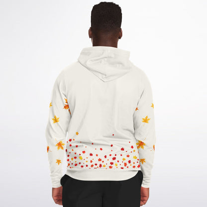 A man viewed from the back wearing a white hooded sweatshirt with an autumn maple leaf print in orange, yellow, and red, paired with black pants, against a plain white background.