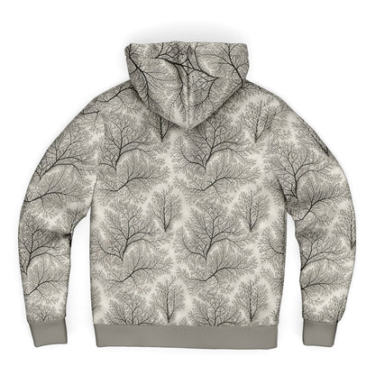 A long-sleeve hoodie with an all-over abstract tree branch pattern in black and gray on a light beige background, featuring solid gray ribbed cuffs and hem, shown against a plain white background.