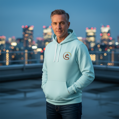 Man wearing a light blue hoodie with a logo, standing against a cityscape at night.