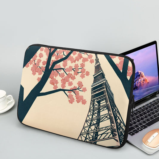 Laptop with a cherry blossom and Tokyo Tower design on a light gray background