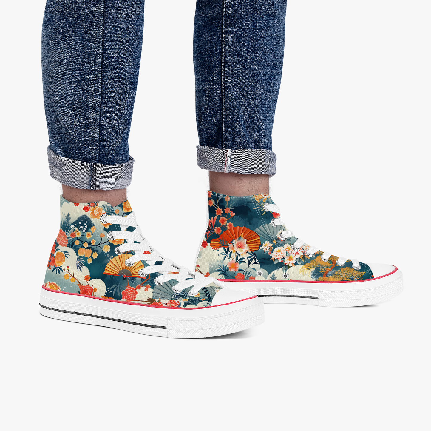 Floral high-top sneakers worn with rolled-up jeans on a white background