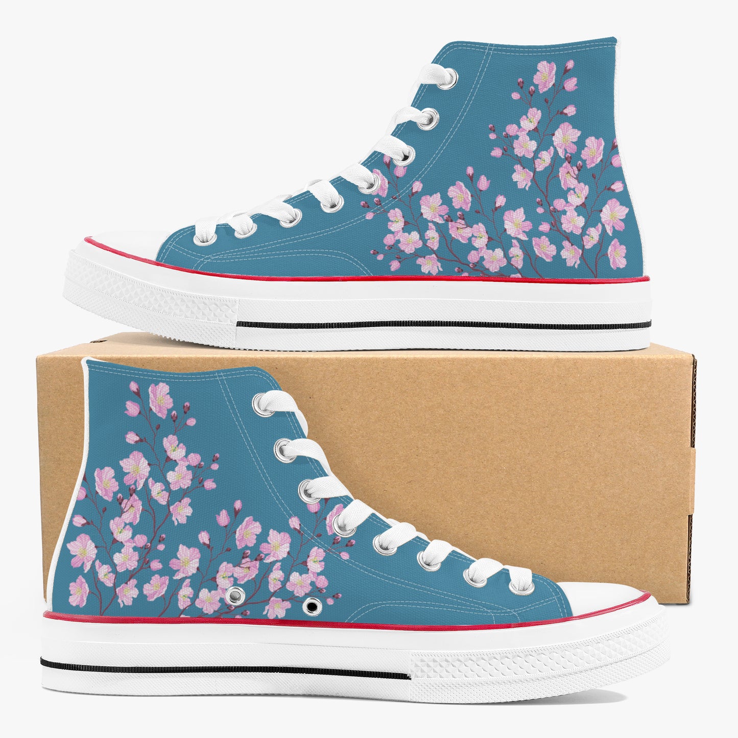 Blue high-top sneakers with pink floral pattern on a cardboard box