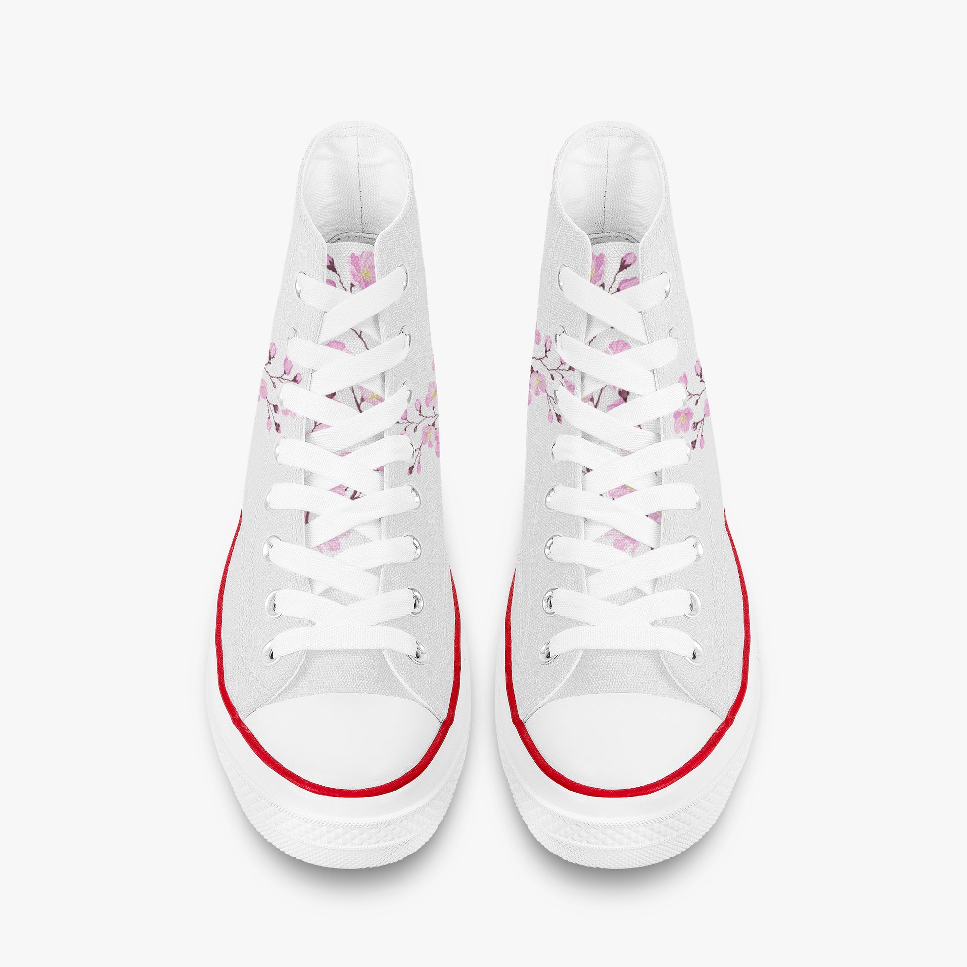 White sneakers with floral patterns and red accents on a white background