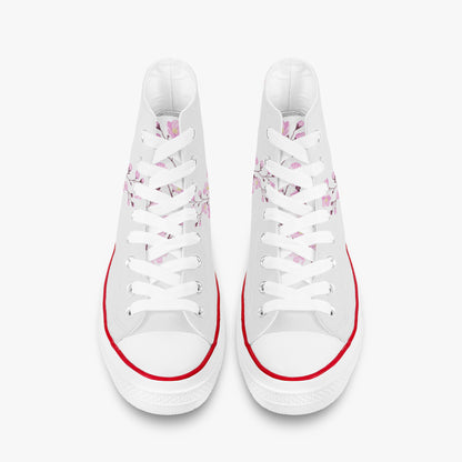 White sneakers with floral patterns and red accents on a white background