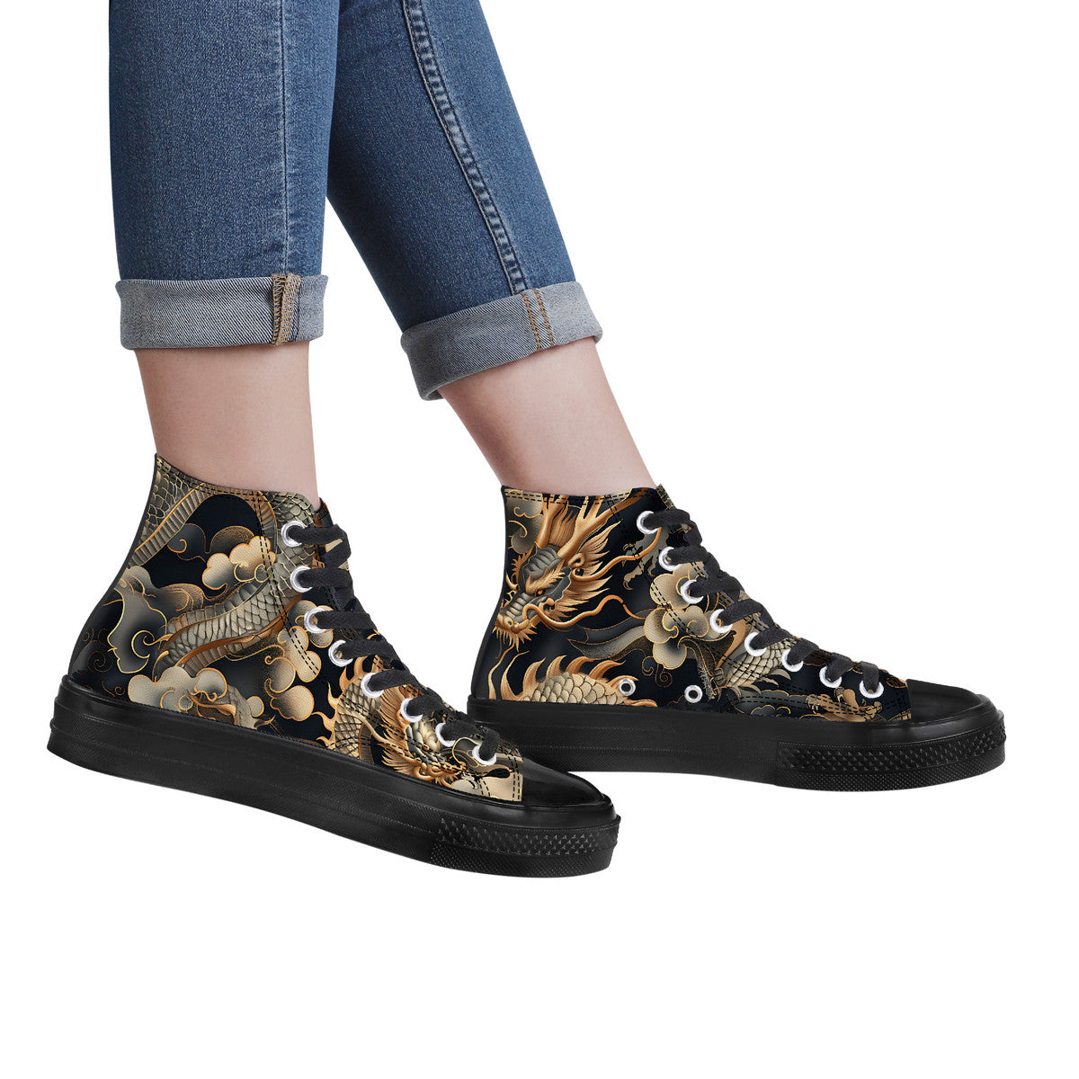 Black high-top sneakers with dragon design worn with rolled-up jeans on a white background