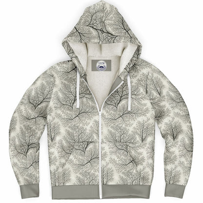 A zip-up hoodie featuring an all-over black line-art tree pattern on a warm off-white background, with a solid gray ribbed hem, cuffs, and drawstrings, and a light beige fleece lining.