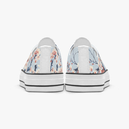 Pair of floral-patterned sneakers on a white background