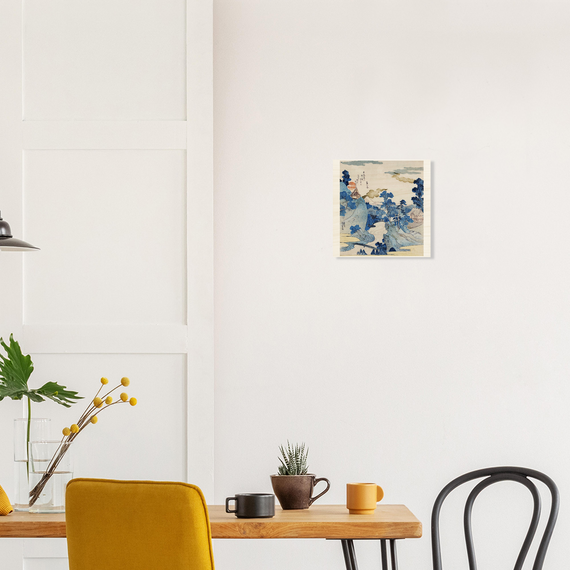 Modern interior with a wooden table, yellow chair, black chair, and abstract art on the wall.