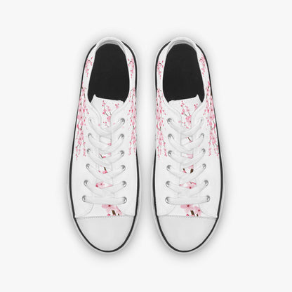 White sneakers with pink floral patterns on a white background