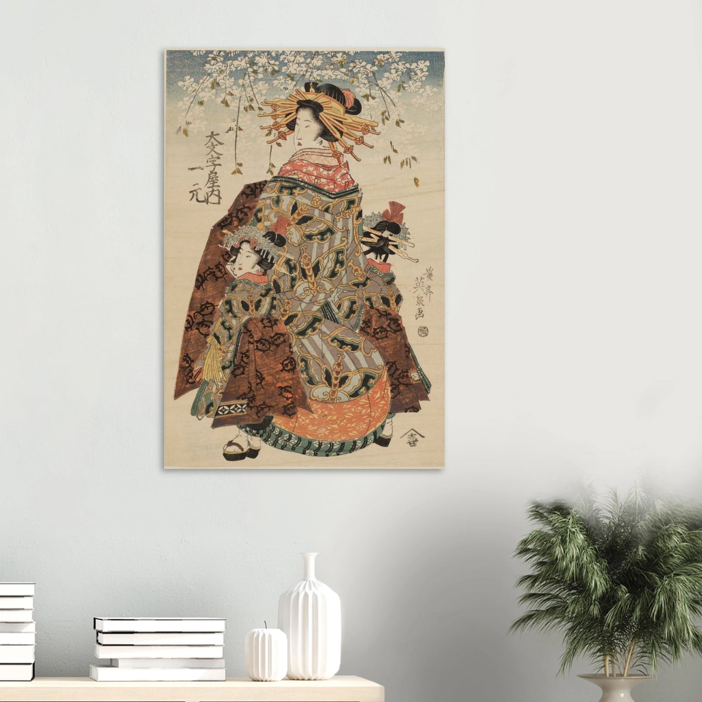 Traditional Japanese artwork of a woman in a kimono on a wall above a shelf with decorative items.