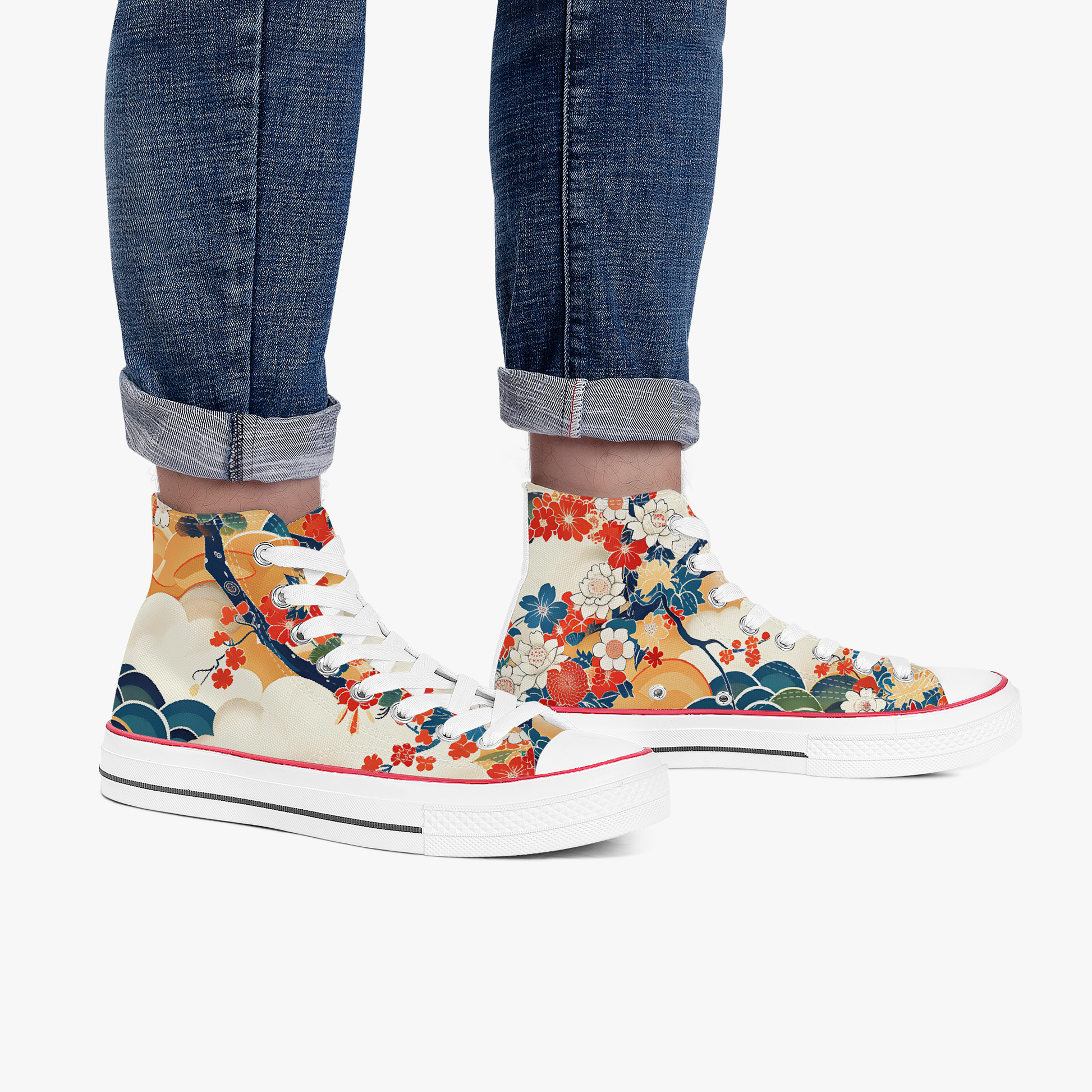 Colorful floral high-top sneakers worn with rolled-up jeans on a white background