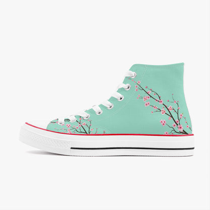 Teal high-top sneaker with cherry blossom design on a white background