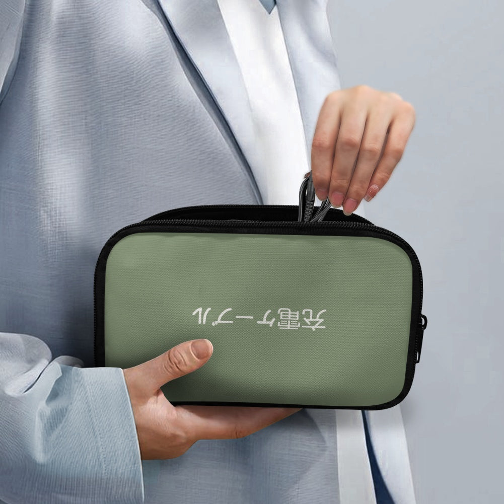 Person holding a green travel pouch with text on a light gray background