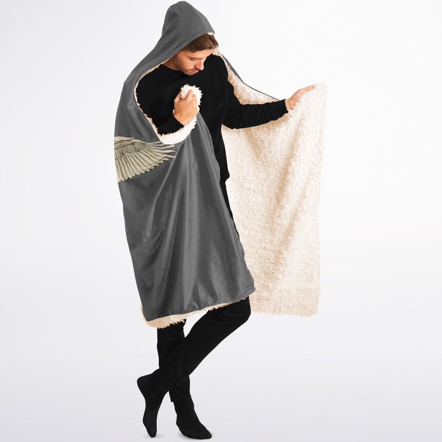 Person wearing a gray hooded poncho with a white interior on a white background